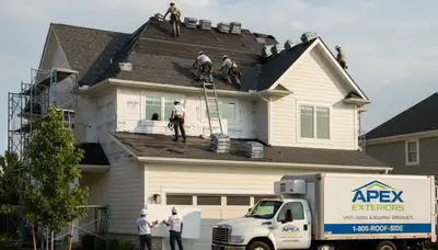Roof replacement and vinyl siding installation on home exterior in Medford, MA